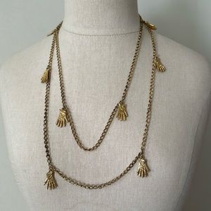 Vintage gold tone glove hand charm long necklace